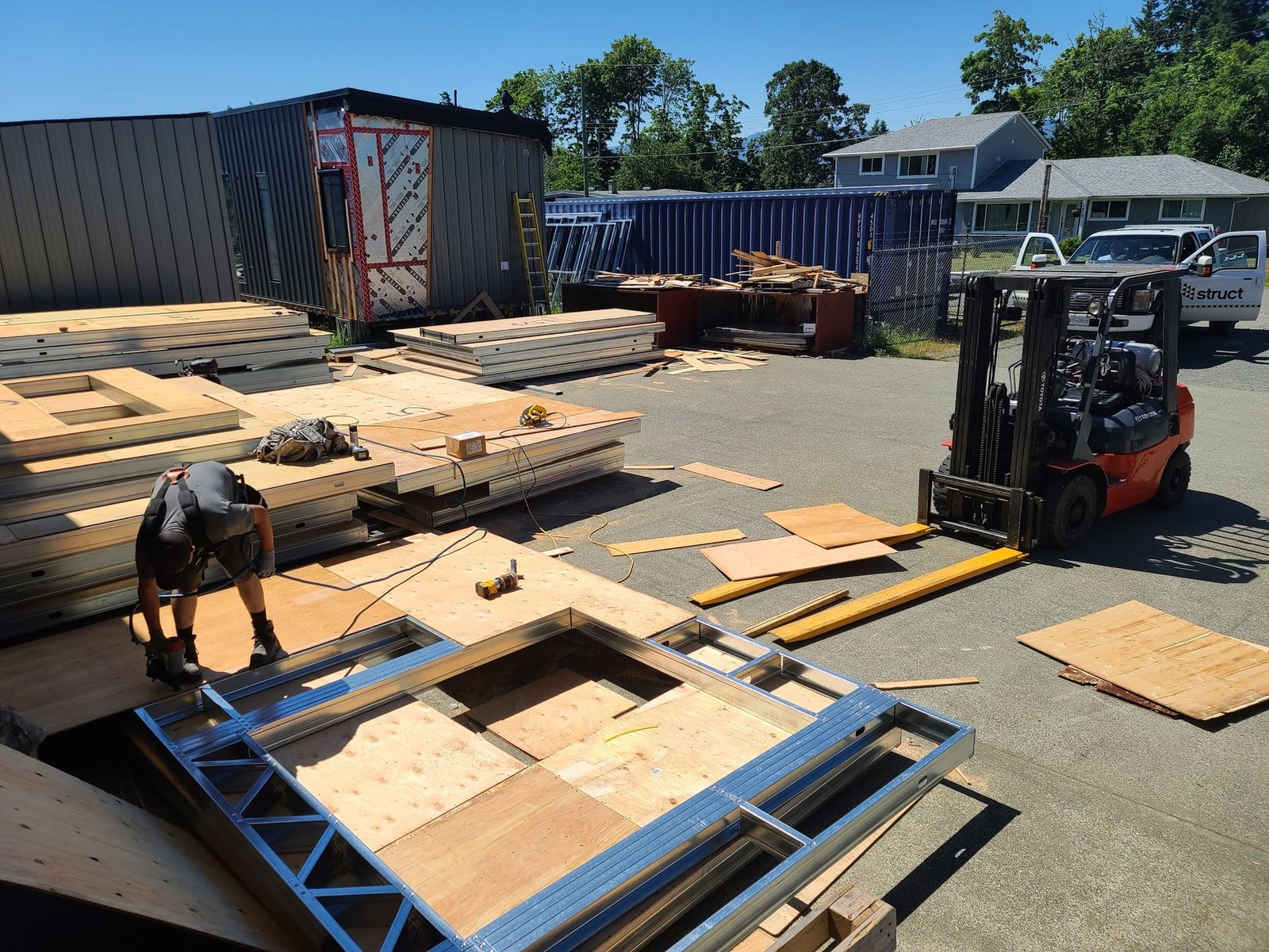 Steel chassis and wall panels on the factory floor